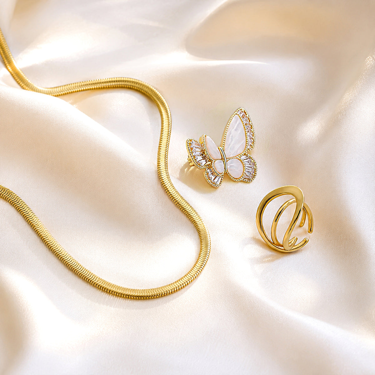 Snake Chain, Pearl Butterfly Brooch & Wave Ring Trio