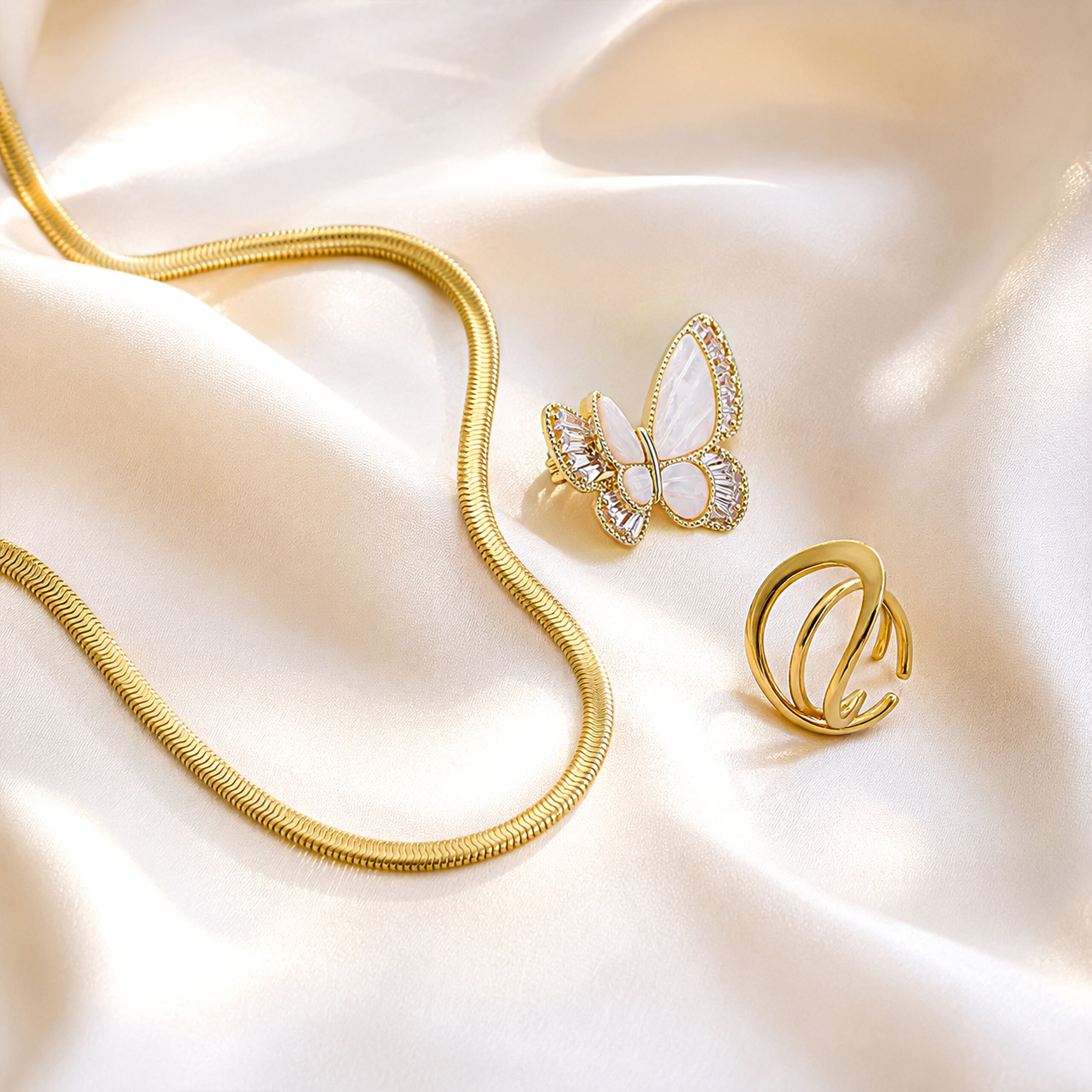 Snake Chain, Pearl Butterfly Brooch & Wave Ring Trio